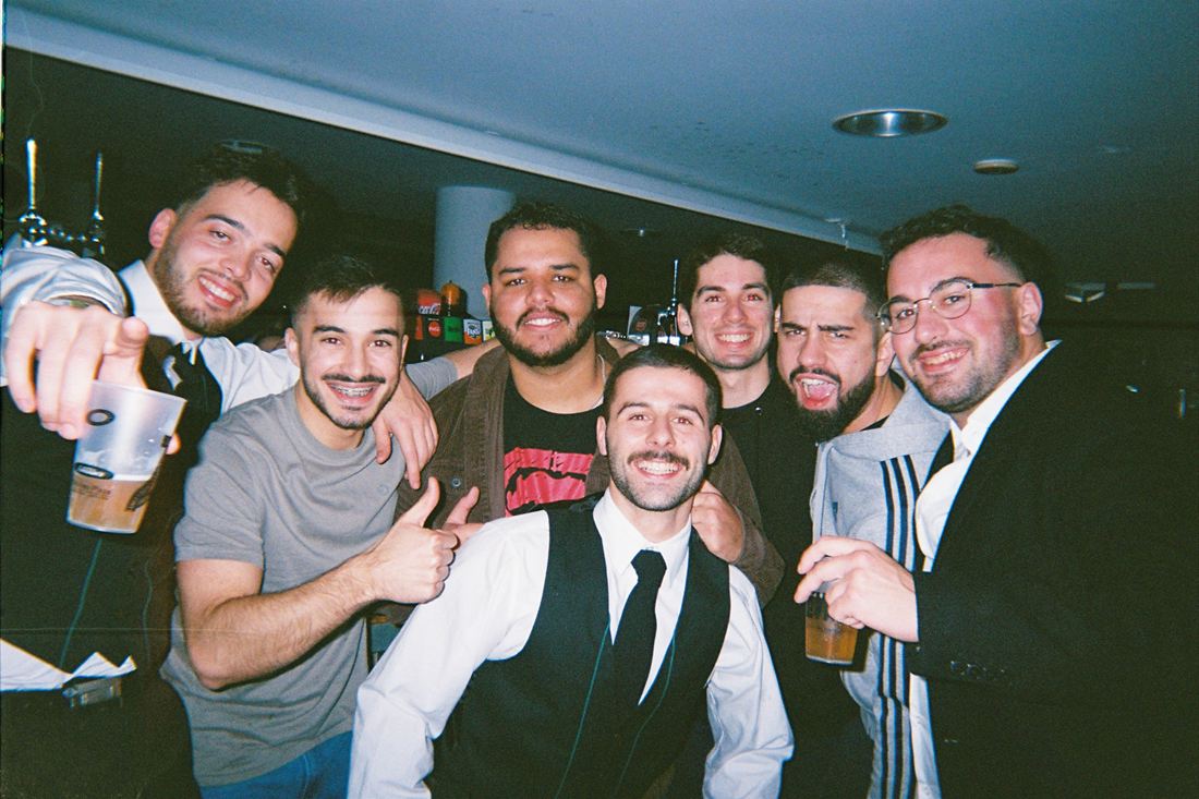 Friends together indoors, shot on film