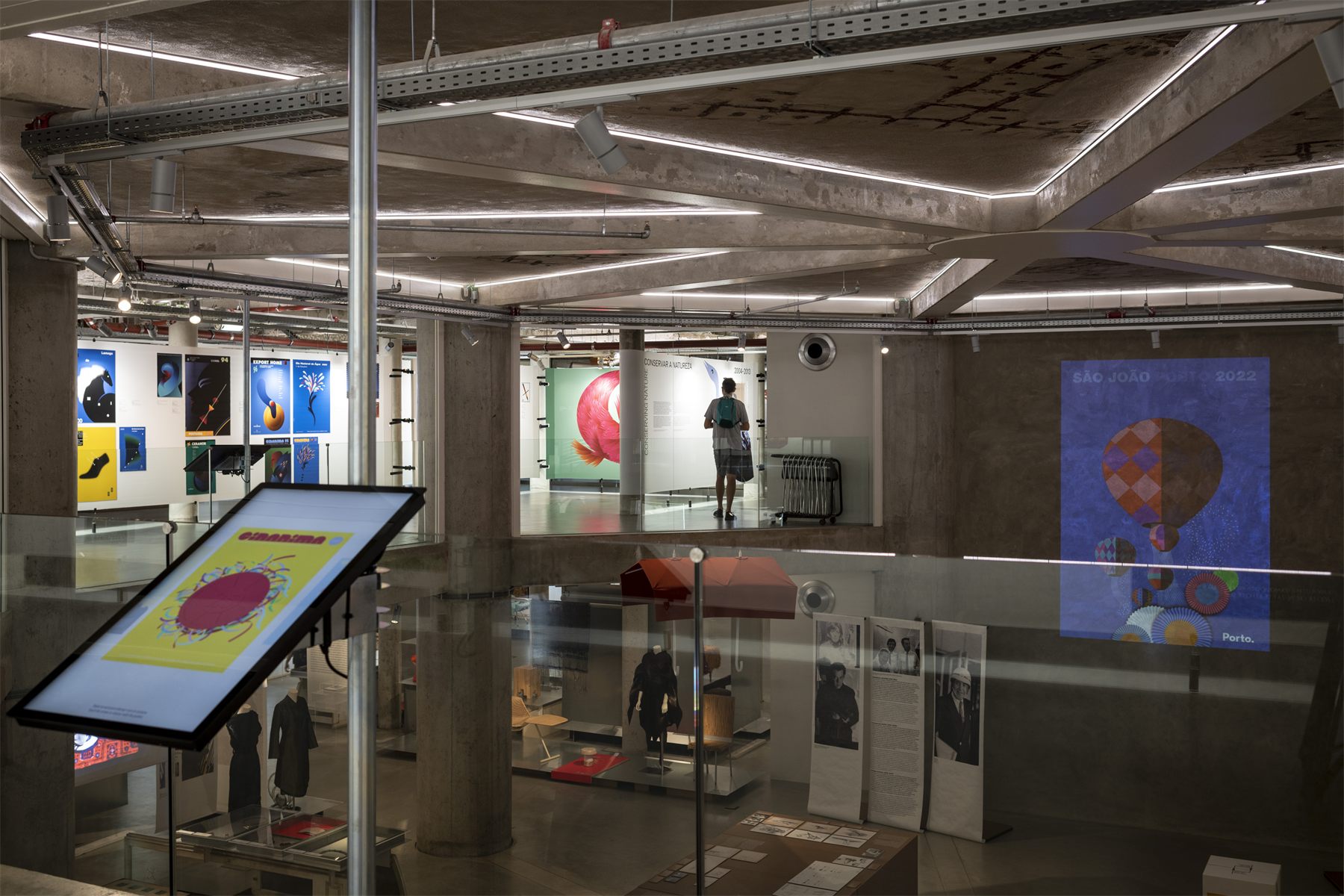 An interactive touchscreen on its support within the exhibition