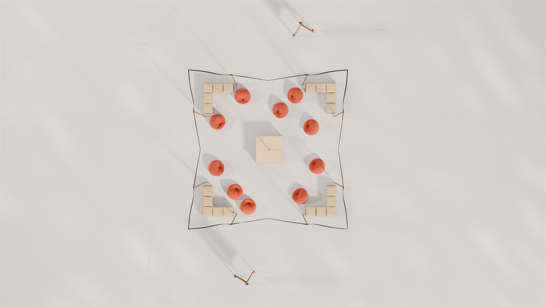 Plan view of the pavilion: the sail canopy, the central table and scattered poufs